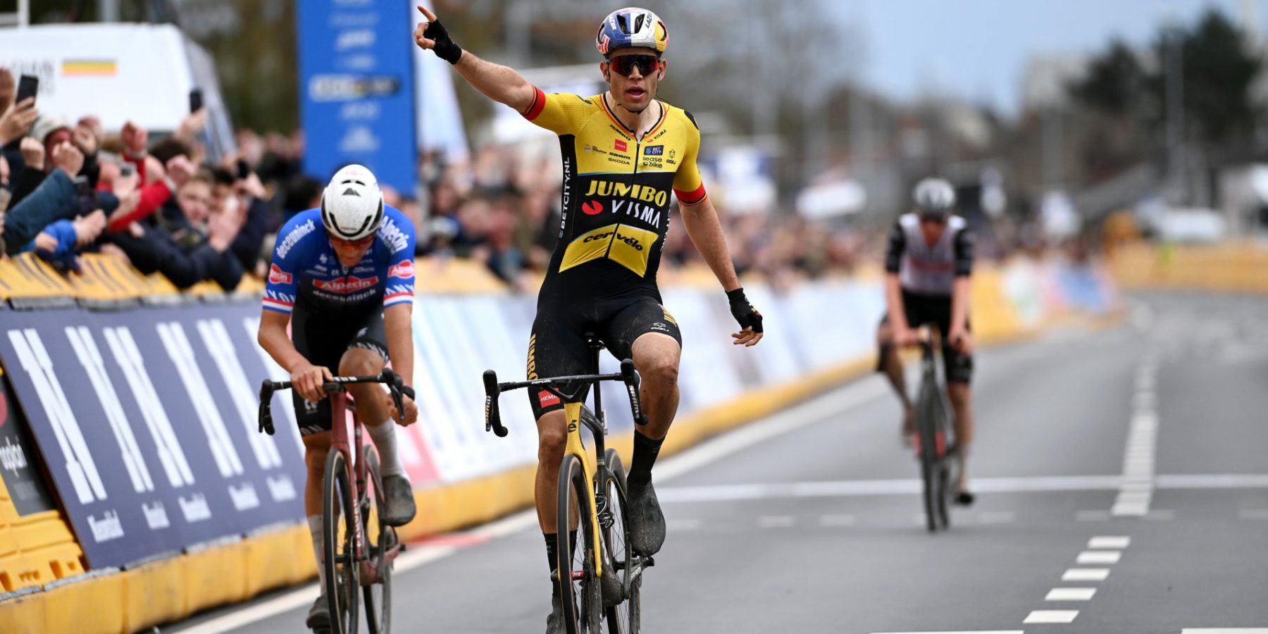 HARELBEKE, BELGIUM - MARCH 24: Wout Van Aert of Belgium and Team Jumbo-Visma celebrates at finish line as race winner ahead of Mathieu Van Der Poel of The Netherlands and Team Alpecin-Deceuninck and Tadej Pogačar of Slovenia and UAE Team Emirates during the 66th E3 Saxo Bank Classic - Harelbeke 2023 a 204.1km one day race from Harelbeke to Harelbeke on / #UCIWT / March 24, 2023 in Harelbeke, Belgium. (Photo by Tim de Waele/Getty Images)